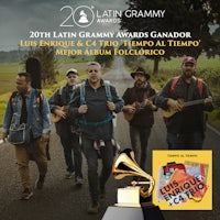 the 20th latin grammy awards with a group of people on a road
